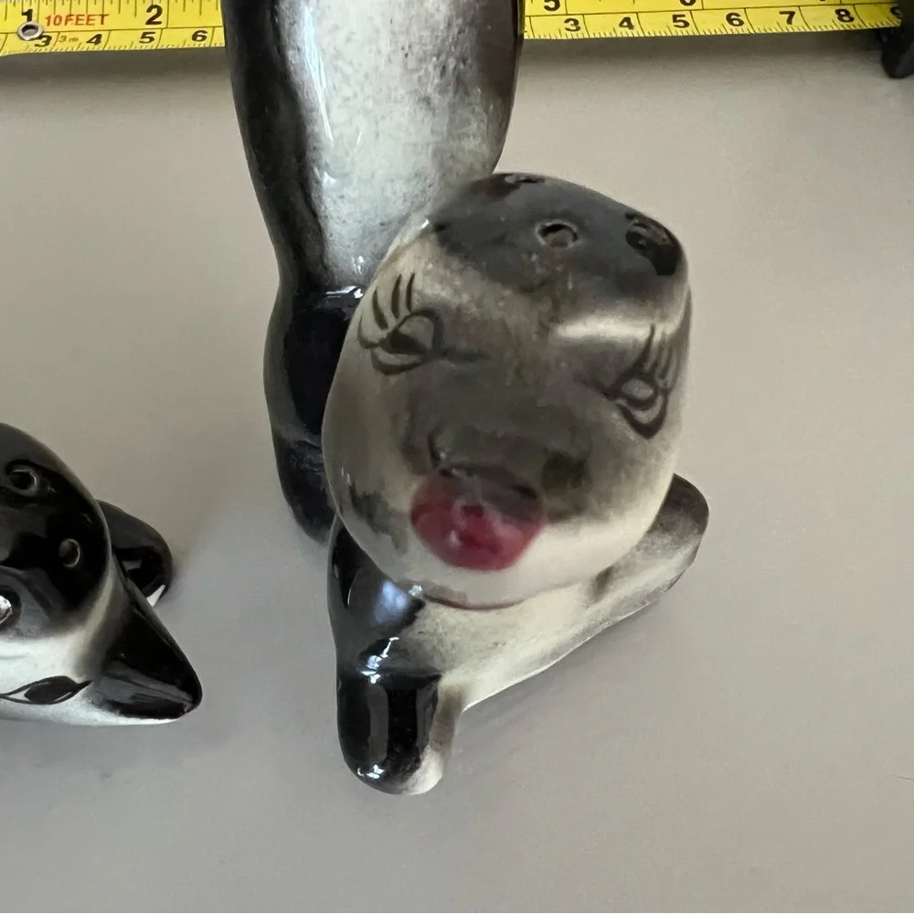 Vintage pair of salt and pepper shaker skunks from Long Beach California